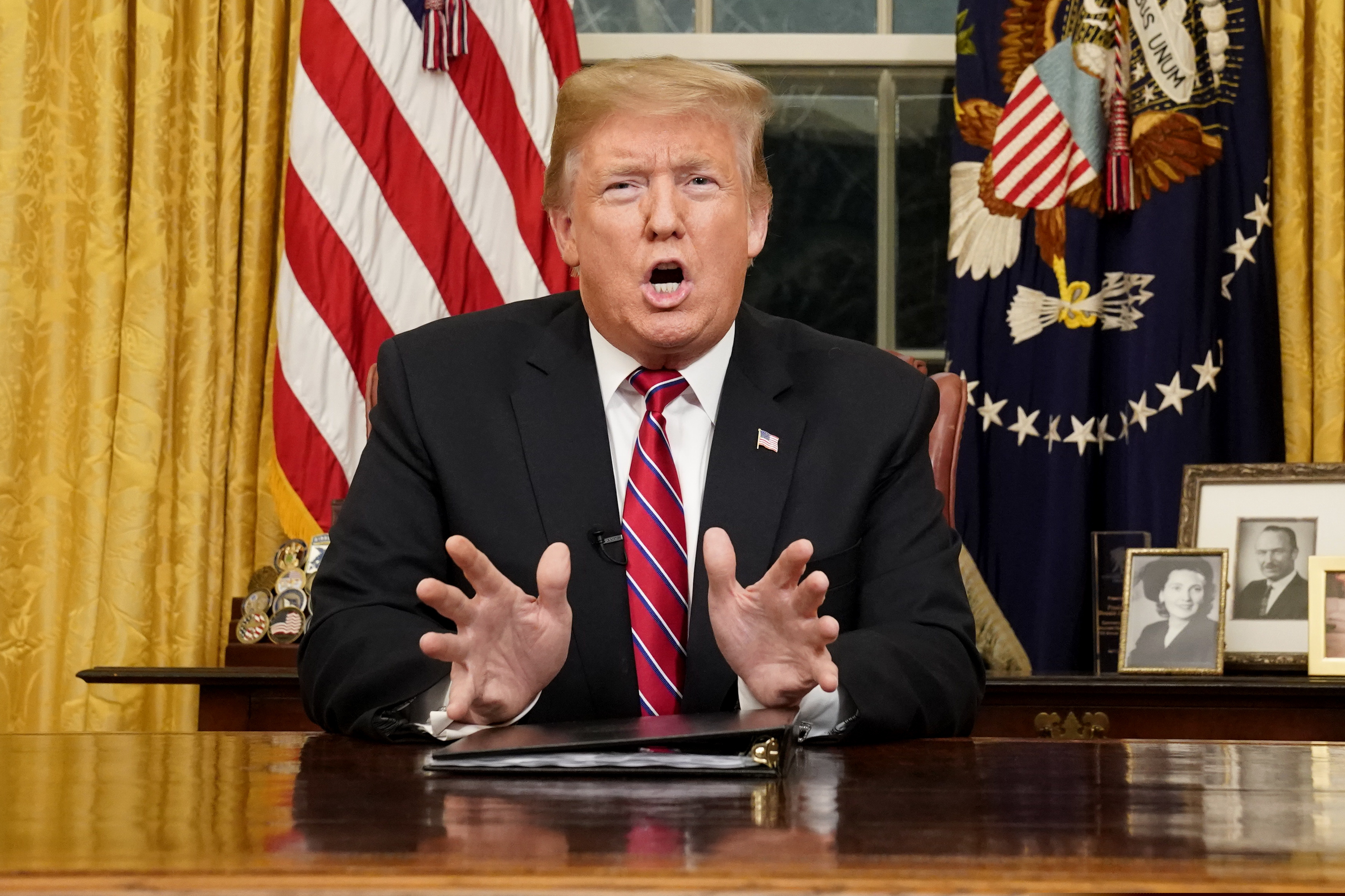 President Donald Trump speaks from the Oval Office of the White House as he gives a prime-time address about border security Tuesday, Jan. 8, 2018, in Washington. (Carlos Barria/Pool Photo via AP)