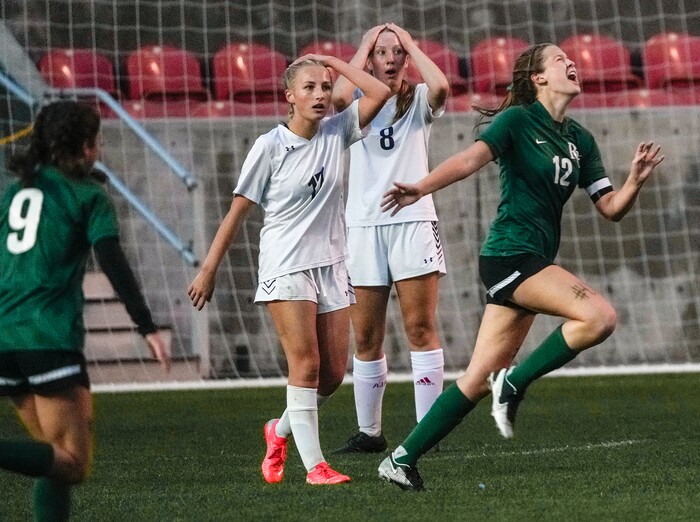 (Leah Hogsten | The Salt Lake Tribune)  RHSM's Kaitlyn Bates celebrates teammate Paige Connery's goal to tie the game 3-3 as Waterford's Madeline Morris and Julia Ostrander are stunned. Waterford School defeated Rowland Hall-St. Marks High School, 4-3 to win the 2A State Soccer Championship game Oct. 23, 2021 at Rio Tinto Stadium.