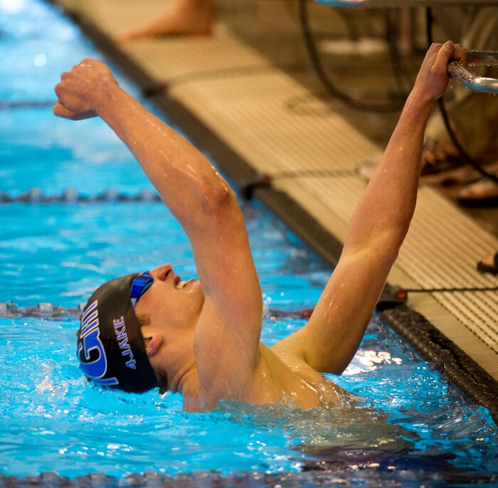 (Rick Egan  |  The Salt Lake Tribune)    Pleasant Grove Swimmer, Devin Bunnell celebrates his first place finish in the Men's 500 Yard Freestyle, in 6A State Swimming Championships in Bountiful, Friday, February 9, 2018.