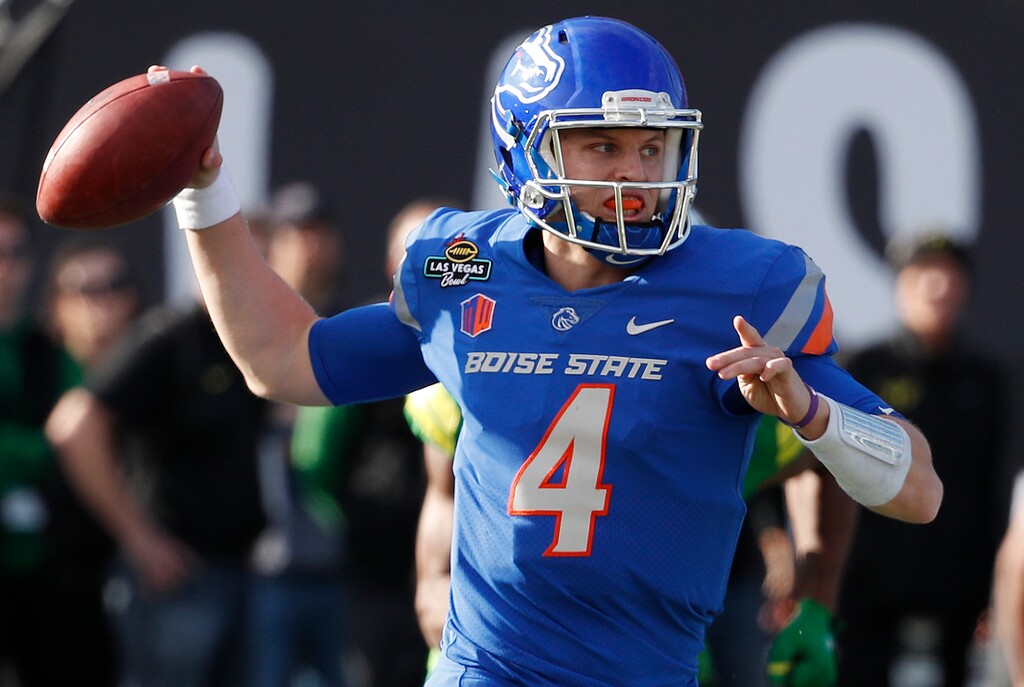 FILE - In this Dec. 16, 2017, file photo, Boise State quarterback Brett Rypien attempts a pass against Oregon during the first half of the Las Vegas Bowl NCAA college football game, in Las Vegas. MWC preseason offensive player of the year Brett Rypien has thrown for 9,876 yards, the highest total of any active Football Bowl Subdivision player. (AP Photo/John Locher, File)