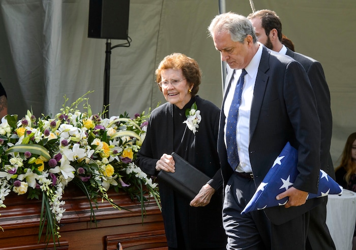 (Steve Griffin  |  The Salt Lake Tribune)  Mary Hales and her son David C. Hales walk past the casket of her husband Elder Robert D Hales following graveside services at the Bountiful City Cemetery in Bountiful Friday October 6, 2017.