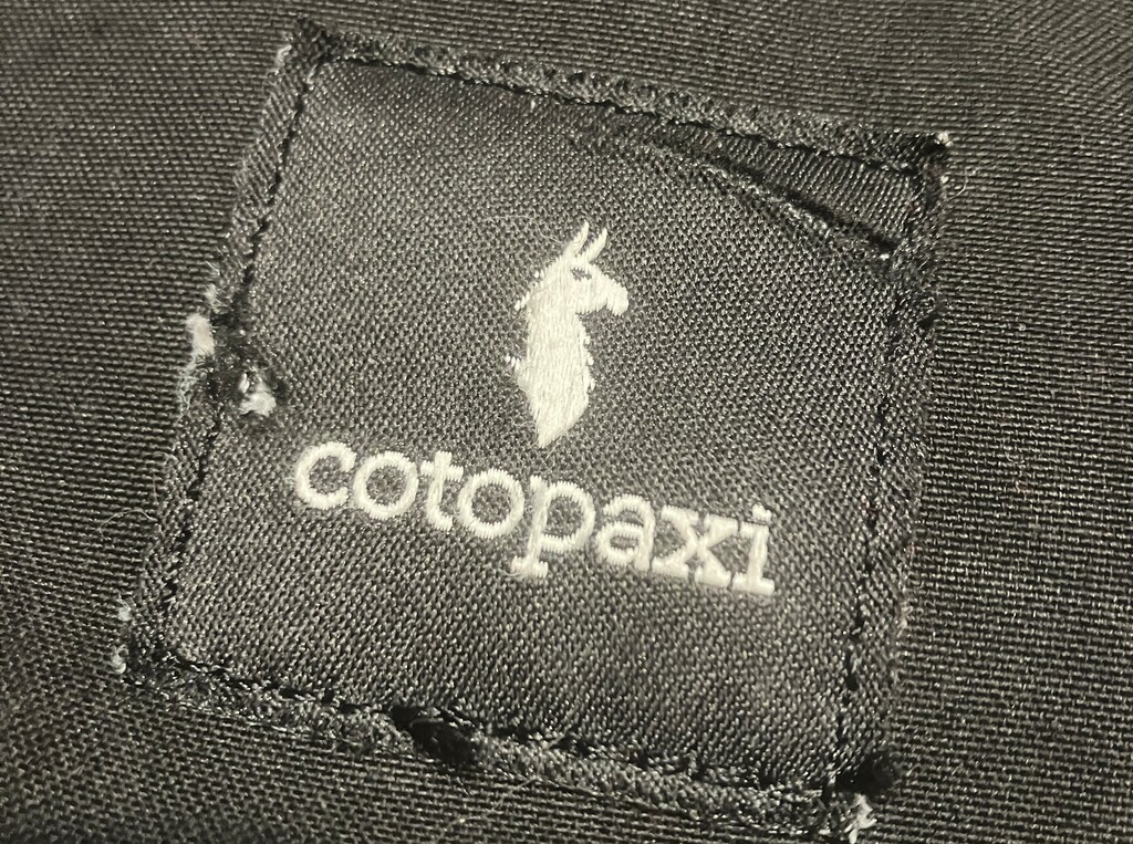(Sean P. Means  |  The Salt Lake Tribune) A weathered label from a Cotopaxi messenger bag. The Salt Lake City company laid off 22 employees in mid-January 2024, according to a company spokesperson.