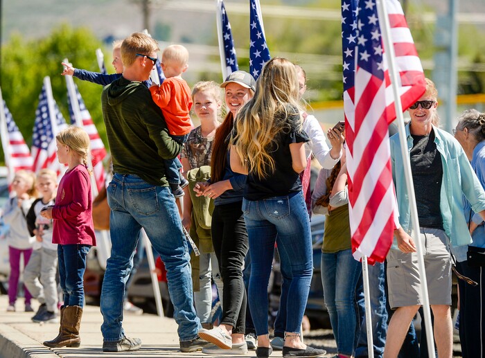 (Leah Hogsten  |  The Salt Lake Tribune) A Heber Valley Railroad passengers wait to board the Heber Creeper train cars at the historic railroad in anticipation of an excursion Monday as American flags honor of our military, past and present, men and women who serve or have served in our Armed Forces, May 25, 2020.