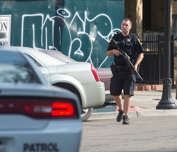 (Rick Egan  |  The Salt Lake Tribune)   Police stand by as swat teams search buildings on Rio Grande Street for a suspect that fired shots at a police officer,  Wednesday, Sept. 5, 2018.


