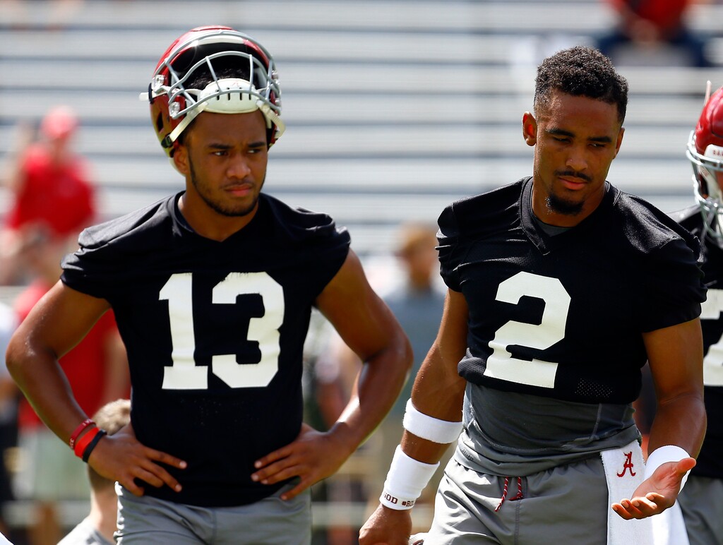 Alabama quarterback Jalen Hurts (2) and quarterback Tua Tagovailoa (13) runs drills during a NCAA college football practice, Saturday, Aug. 4, 2018, in Tuscaloosa, Ala. (AP Photo/Butch Dill)