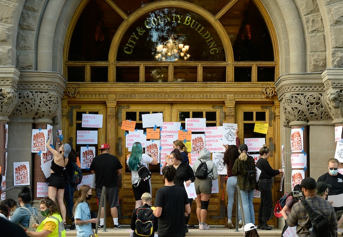 (Francisco Kjolseth  |  The Salt Lake Tribune) Demonstrators plaster City Hall with signs in Salt Lake City for a Justice for Bernardo Palacios Rally, on Thursday, June 18, 2020.