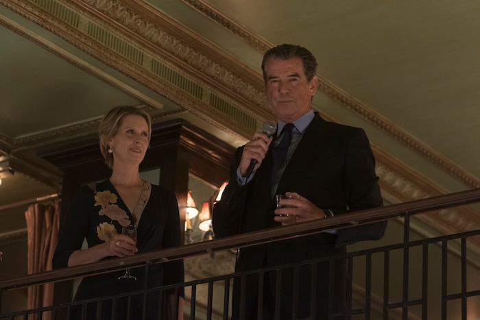 (Niko Tavernise  |  Amazon Studios/Roadside Attractions) Publisher Ethan Webb (Pierce Brosnan, right) addresses partygoers alongside his wife, Judith (Cynthia Nixon), in the drama "The Only Living Boy in New York."