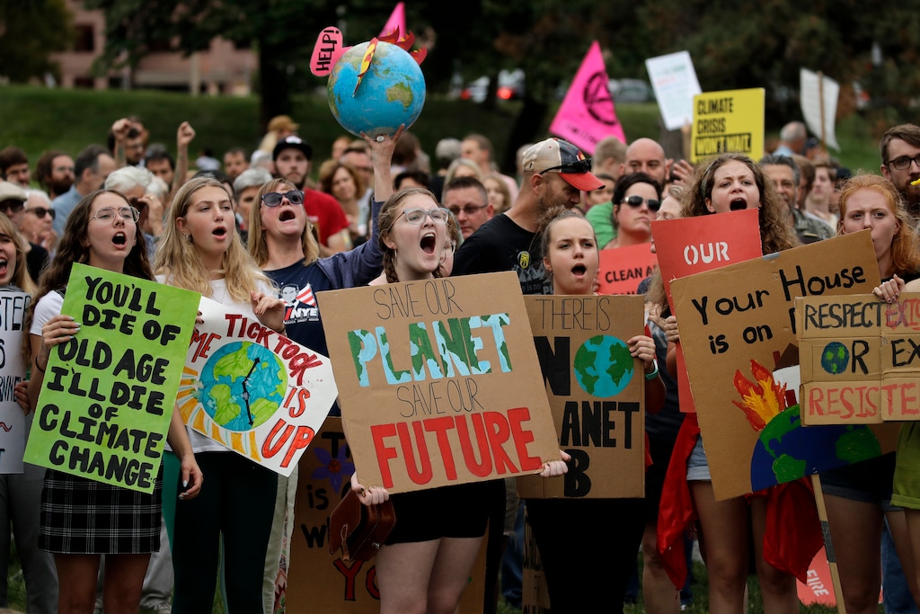 (Charlie Riedel | AP) Climate protesters demonstrate Friday, Sept. 20, 2019, in Kansas City, Mo. Across the globe, people took to the streets Friday to demand that leaders tackle climate change in the run-up to a U.N. summit.