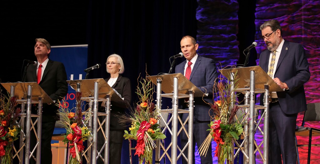 FILE - In this Friday, Oct. 13, 2017 file photo, United Utah Party's Jim Bennett, from left, Democrat Dr. Kathryn Allen, Republican John Curtis and Libertarian Joe Buchman attend Utah's 3rd Congressional District debate in a race to replace Jason Chaffetz in the U.S. House of Representatives in Sandy, Utah. (AP Photo/Rick Bowmer, File)
