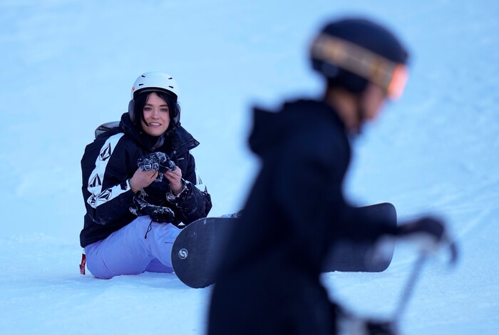 (Bethany Baker | The Salt Lake Tribune) Molly Blackham takes off her snowboard at Sundance Resort near Provo on Thursday, Dec. 14, 2023.