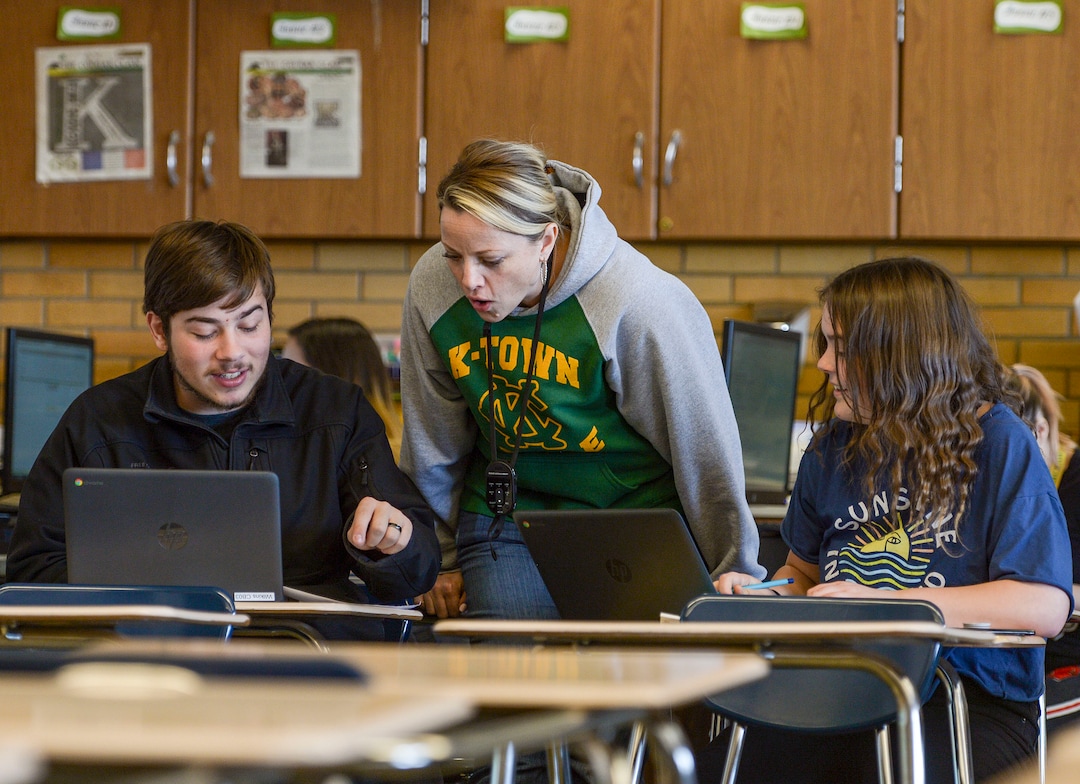 (Leah Hogsten  |  The Salt Lake Tribune) Journalism instructor Kathryn Wilkins shares story ideas with Korbyn Casaza, left, and Bridgette Thornock in class Nov. 26. The student newspaper at Kearns High School, The Cougar Claw, is working to become the community newspaper for Kearns.