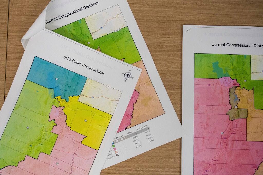 Maps at a news conference held by the Utah's bipartisan redistricting panel in Taylorsville, Utah on Tuesday, Oct. 26, 2021. (Trent Nelson/The Salt Lake Tribune via AP)