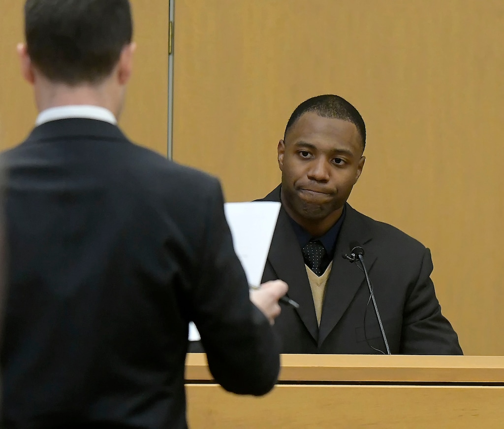 Prosecuting attorney Spencer Walsh, left, asks a question to Torrey Green during Green's rape trial, Tuesday, Jan.15, 2019 in Brigham City, Utah. Green is accused of raping multiple women while he was a football player at Utah State University. (Eli Lucero/Herald Journal via AP)