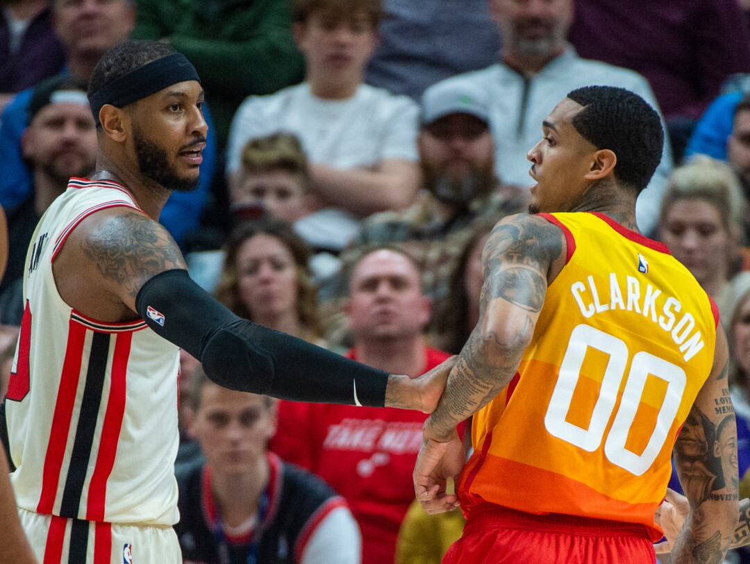 (Rick Egan  |  The Salt Lake Tribune)     Portland Trail Blazers forward Carmelo Anthony (00) grabs Utah Jazz guard Jordan Clarkson (00), in the Jazz 117-114 win over the Portland Trail Blazers, in NBA action in Salt Lake City, Friday, Feb. 7, 2020.