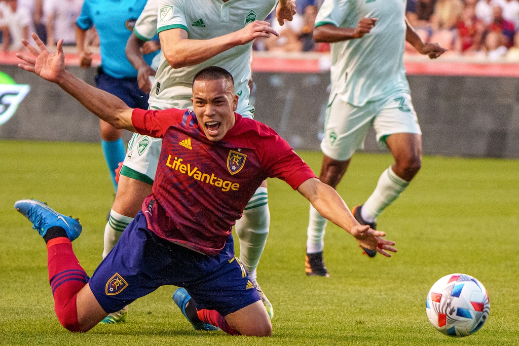 (Trent Nelson | The Salt Lake Tribune) Real Salt Lake forward Bobby Wood (7) falls, defended by Colorado Rapids defender Danny Wilson (4) as Real Salt Lake hosts the Colorado Rapids, MLS Soccer at Rio Tinto Stadium in Sandy on Saturday, July 24, 2021.