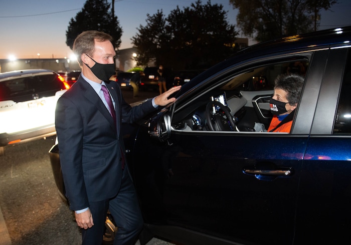 (Francisco Kjolseth  |  The Salt Lake Tribune) Democratic Rep. Ben McAdams, looking to retain his seat for Utah’s 4th Congressional District, says hello to Rep. Patrice Aren’t, D-Millcreek, as he hands out pre-ordered meals to friends and supporters at Pat’s BBQ in Salt Lake City, as part of his small election night watch party on Tuesday, Nov. 3, 2020.