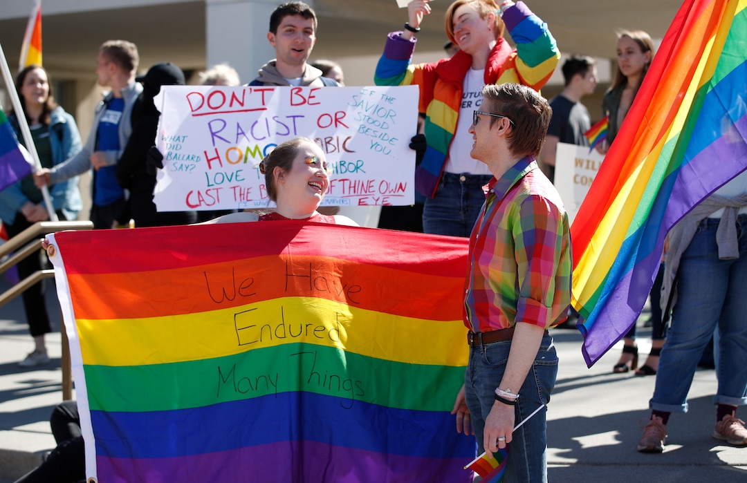 (George Frey  |  special to The Salt Lake Tribune) BYU students and others gather in front of the Ernest L. Wilkinson Student Center on the campus of Brigham Young University to protest BYUÕs rollback of a newly announced policy change on LGBTQ students on March 5, 2020 in Provo, Utah.