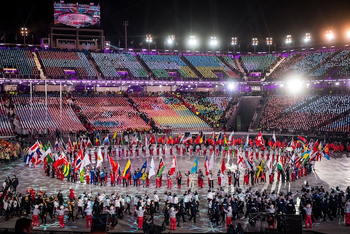 (Chris Detrick | The Salt Lake Tribune) Athletes walk around the stadium during the PyeongChang 2018 Olympic Winter Games Closing Ceremony at Olympic Stadium Sunday, Feb. 25, 2018.