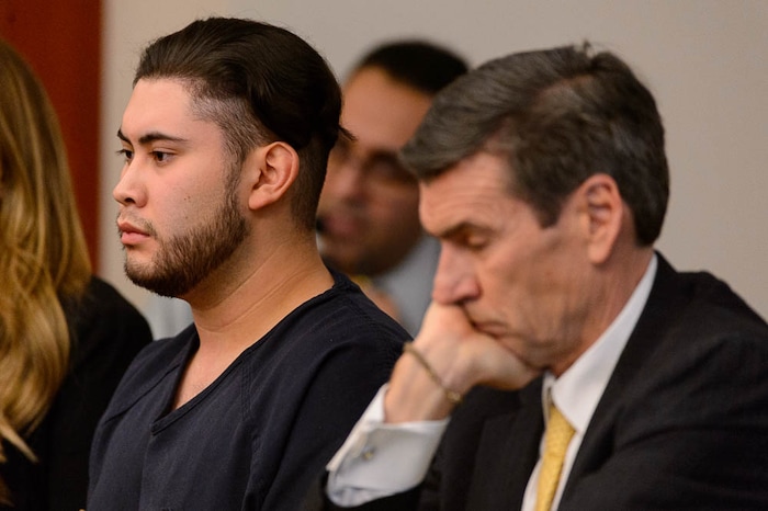 (Trent Nelson | The Salt Lake Tribune)  Abraham Miranda listens to statements from victims and their families at his sentencing in Salt Lake City, Thursday December 21, 2017. Miranda, 19, pleaded guilty to manslaughter counts for a February crash that killed two of his West High School classmates and critically injured a pregnant woman and her baby. At right is Miranda's attorney Greg Skordas.
