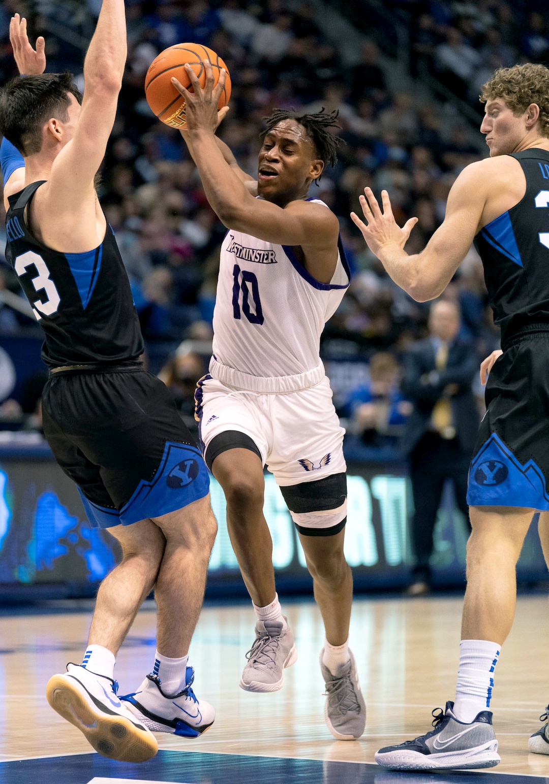 (Francisco Kjolseth | The Salt Lake Tribune) Westminster Griffins guard Donaval Avila (10) tries to push past the defense in basketball action between the Brigham Young Cougars and the Westminster Griffins at the Marriott Center in Provo, Wednesday, Dec. 29, 2021.