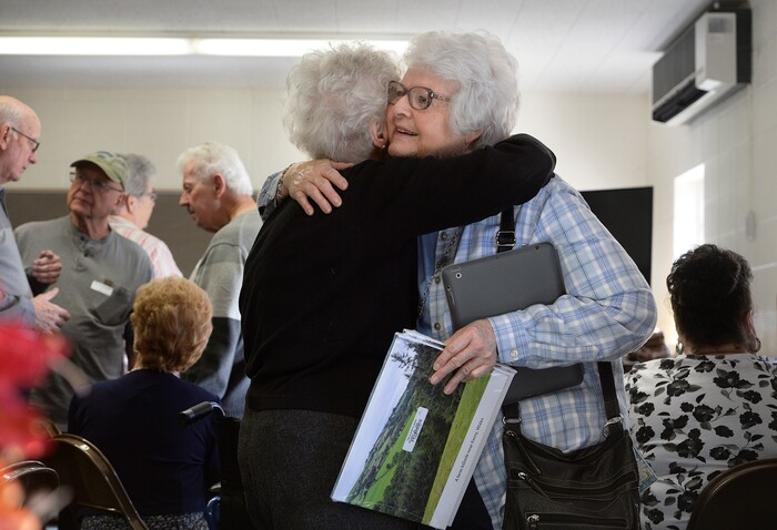 (Scott Sommerdorf | The Salt Lake Tribune) Carol Sperry, left, and Marilyn Dodge Meecham, right, embrace as their families gathered for a reunion, Thursday, November 9, 2017 at the Bountiful Tabernacle.