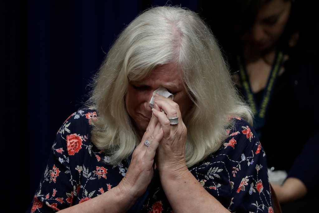 (Matt Rourke  |  The Associated Press) Judy Deaven, who says her son was a victim of sexual abuse by a priest as a boy, reacts as Pennsylvania Attorney General Josh Shapiro speaks during a news conference at the Pennsylvania Capitol in Harrisburg, Tuesday, Aug. 14, 2018. A Pennsylvania grand jury says its investigation of clergy sexual abuse identified more than 1,000 child victims. The grand jury report released Tuesday says that number comes from records in six Roman Catholic dioceses.
