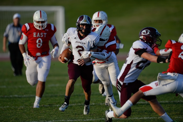 Francisco Kjolseth  |  The Salt Lake TribuneJordan's Austin Kafentzis runs the ball down field past East High school in game action on Friday, Aug. 29, 2014, at East.