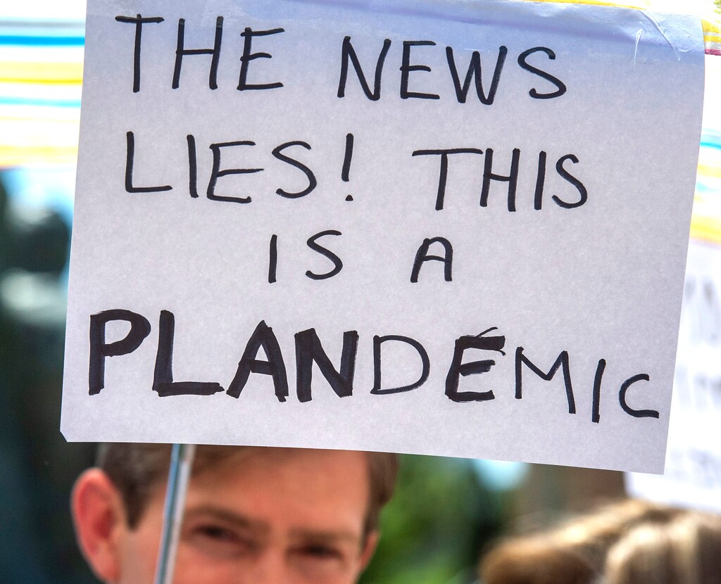 (Rick Egan  |  Tribune file photo)    Residents gather for a rally protesting against masks being required in schools, before the Utah County Commission meeting in Provo, on Wednesday, July 15, 2020.