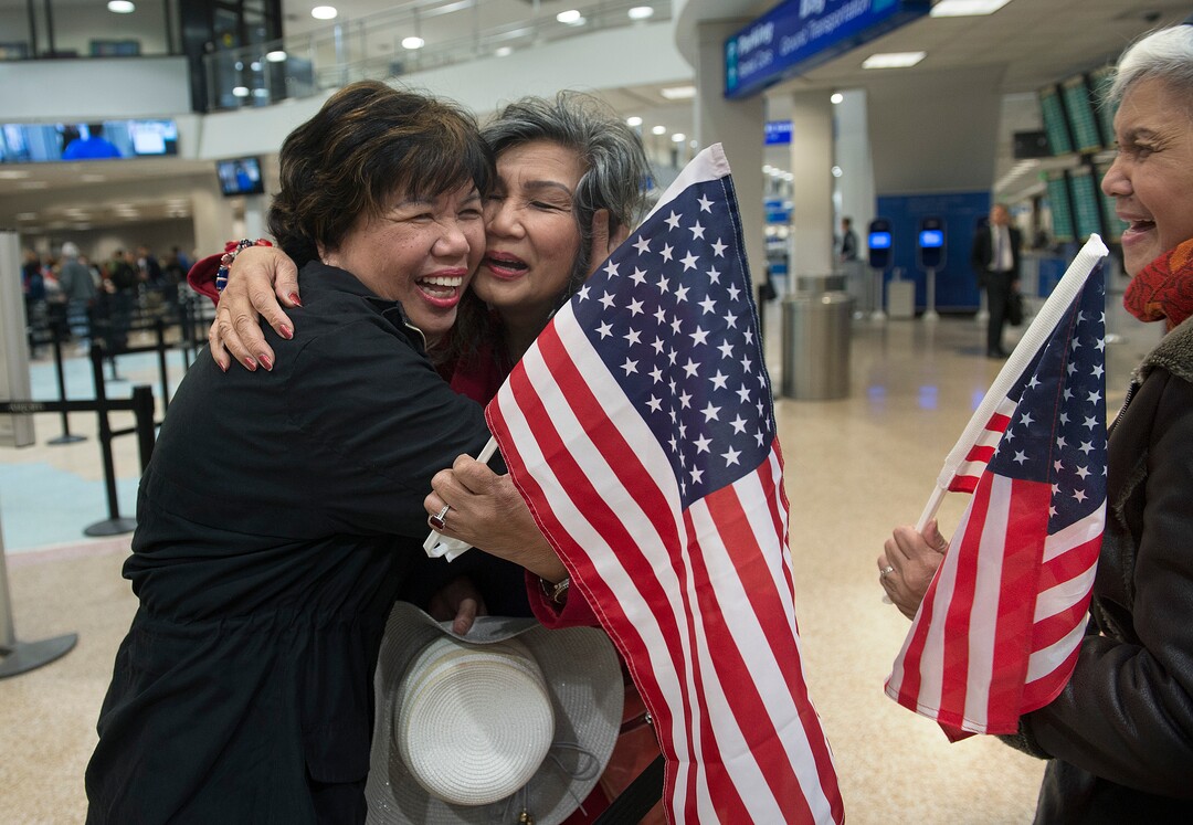 Scott Sommerdorf | The Salt Lake TribuneCorazon Espinosa, left, hugs her sister Celeste Galbreath after arriving from Australia, via Los Angeles, Thursday, Mar. 1, 2018. Espinosa has been trying to legally immigrate to the U.S. for 40 years. Sister Carolina Pangilinan is at right.
