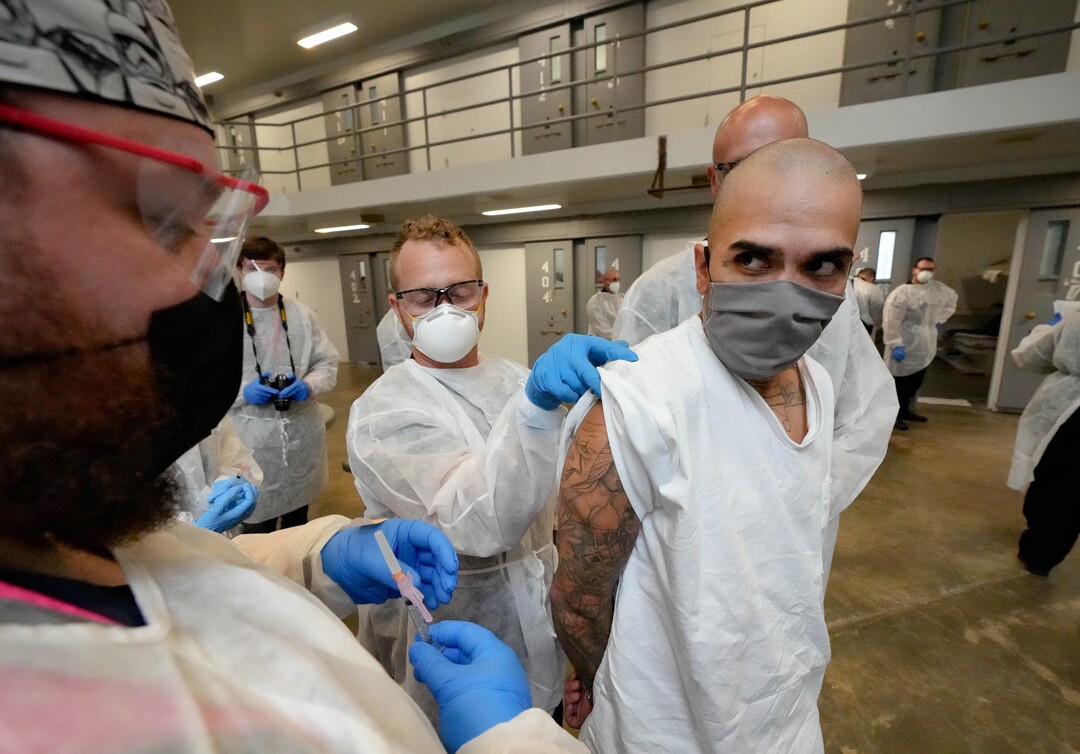 (Francisco Kjolseth | The Salt Lake Tribune) Sean Gonzales receives the COVID-19 vaccine from Nomi Health staff at the Utah State Prison in Draper, on Tuesday, July 27, 2021.