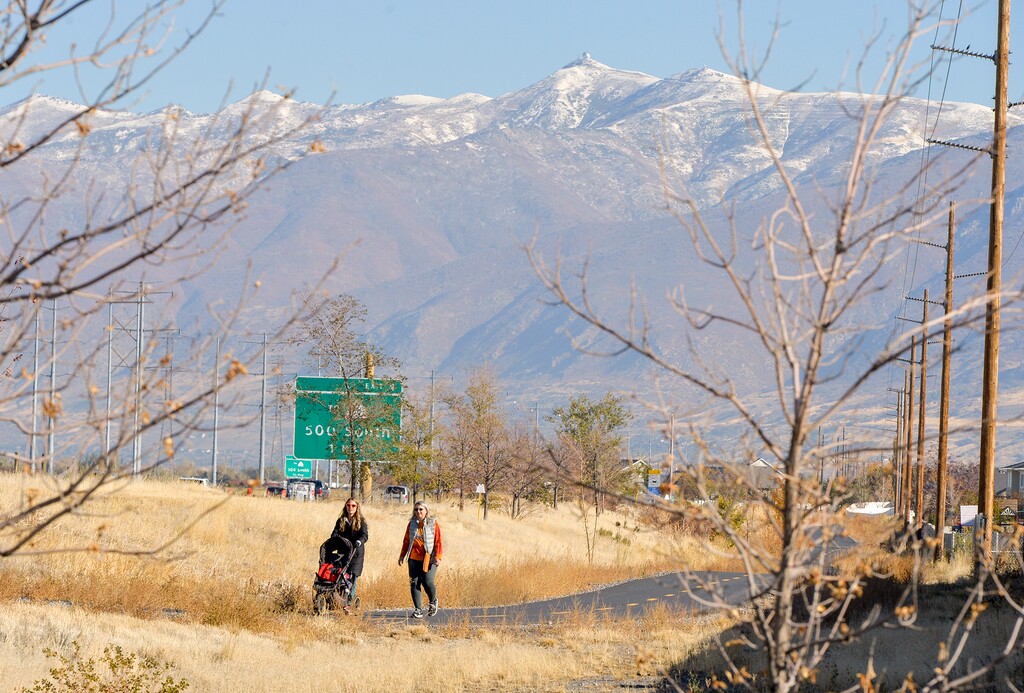 (Chris Samuels | The Salt Lake Tribune) People recreate on  the Legacy Parkway Trail in Woods Cross, Friday, Oct. 28, 2022. Gov. Spencer Cox and Utah Department of Transportation executive director Carlos Braceras announced a new statewide trail network on Friday.