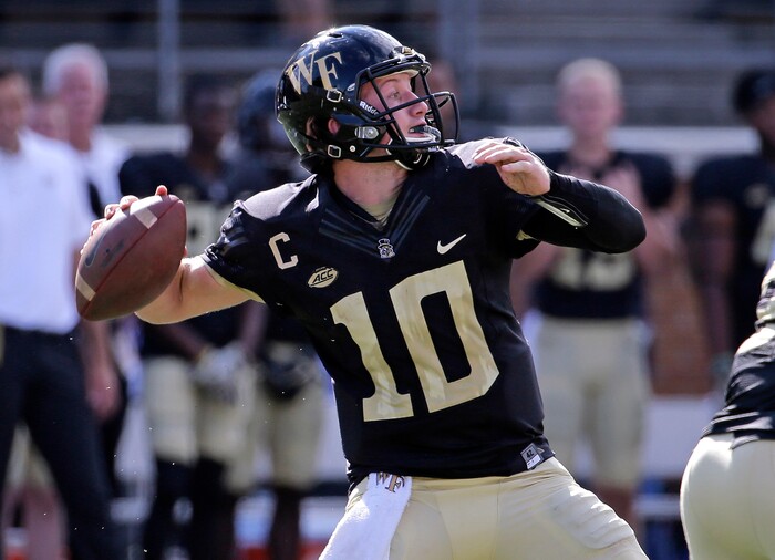 Wake Forest's John Wolford (10) looks to pass against Utah State in the first half of an NCAA college football game in Winston-Salem, N.C., Saturday, Sept. 16, 2017. (AP Photo/Chuck Burton)