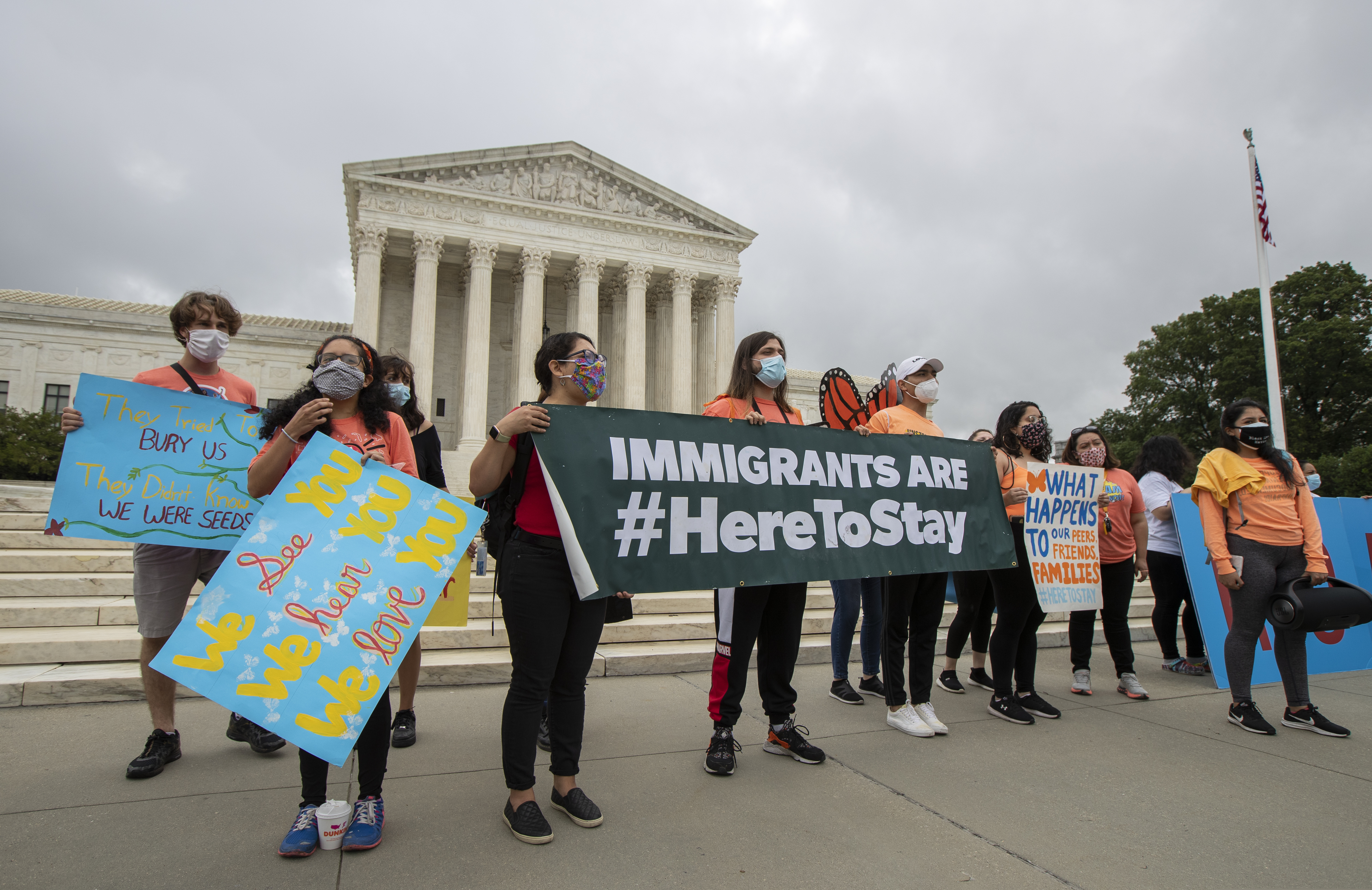 In this June 18, 2020, photo, Deferred Action for Childhood Arrivals (DACA) students celebrate in front of the Supreme Court after the Supreme Court rejected President Donald Trump's effort to end legal protections for young immigrants in Washington. (AP Photo/Manuel Balce Ceneta)