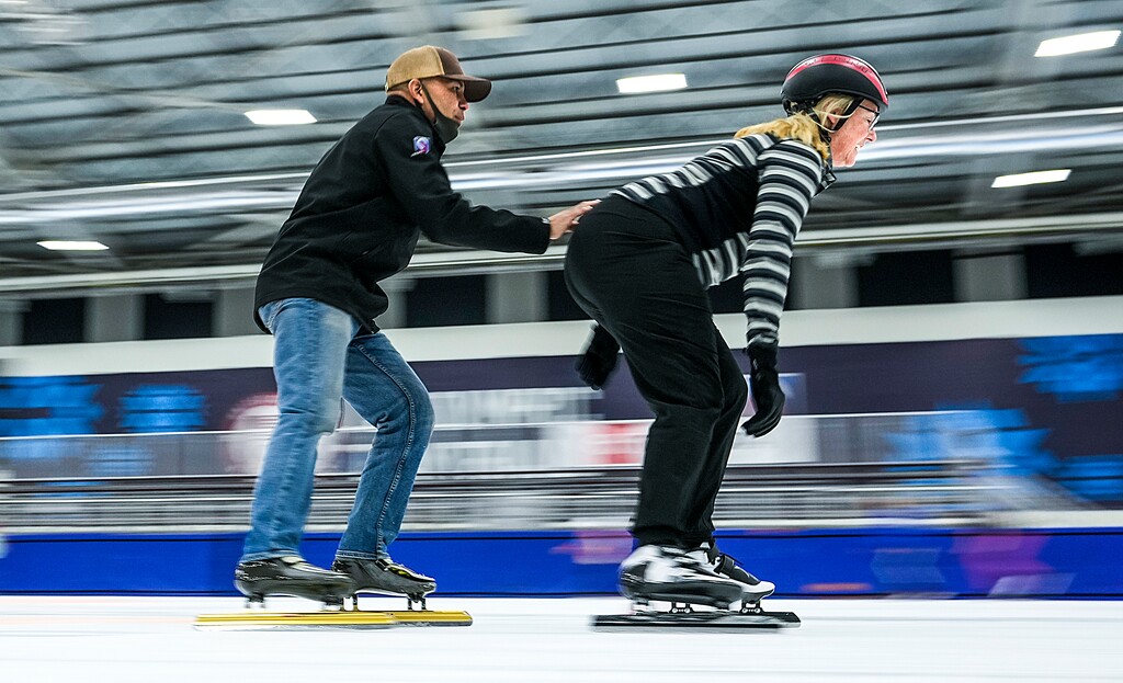 (Leah Hogsten | The Salt Lake Tribune) LeeAnn Colgan gets a steadied by the hand of her speed skating instrutor, Olympian Derek Parra, Nov. 16, 2021. Speed skating is just one of many sports to discover at the Utah Olympic Oval in Kearns that include figure skating, curling, hockey and track running, Nov. 16, 2021.
