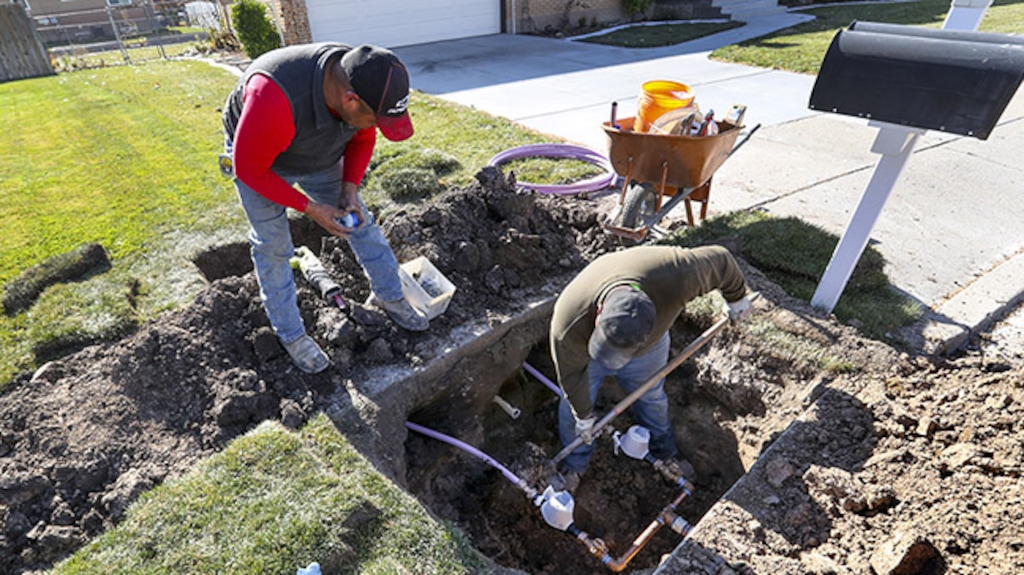 (Steve Griffin | Deseret News) Ormond Construction crews instal secondary water meters in a subdivision in Woods Cross for the Weber Basin Water Conservancy District on Thursday, Nov. 7, 2019.