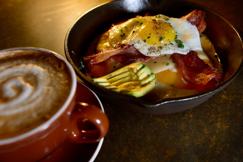 Scott Sommerdorf   |  The Salt Lake TribuneThe Kentucky hot brown:  smothered turkey, topped with bacon, Swiss, tomato, avocado and a sunny side up egg perched on a foundation of sourdough bread at Hub & Spoke Diner, Saturday, September 5, 2015.