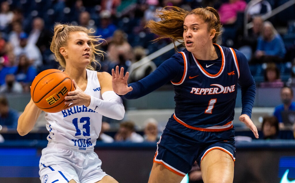 (Rick Egan | The Salt Lake Tribune) BYU Cougars guard Paisley Harding (13) looks for a shot, as Pepperdine Waves guard Malia Bambrick (1) defends, in women's basketball action between the BYU Cougars and the Pepperdine Waves, at the Marriott Center in Provo, on Thursday, Feb. 10, 2022.