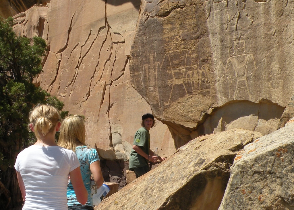 (Erin Alberty|The Salt Lake Tribune) Visitors hike to Fremont petroglyphs at McConkie Ranch in Dry Fork Canyon near Vernal.