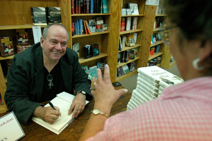 (Tribune file photo)  Author Tom Mathews passes the time with Debbie Krings during his book signing of "Our Fathers' War" at Sam Weller's Bookstore in Salt Lake City July 21, 2005. The Salt Lake City native wrote for The Salt Lake Tribune then helped start the Peace Corps and later worked for Robert F. Kennedy’s presidential campaign. Mathews died Oct. 14, 2017. He was 96.