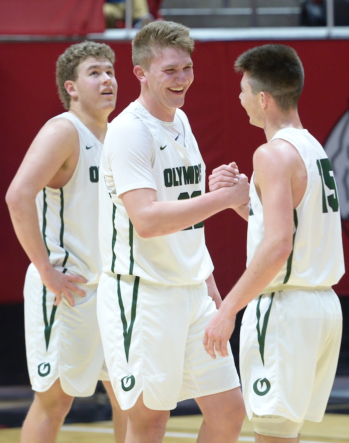 (Leah Hogsten | The Salt Lake Tribune) Olympus' Harrison Creer (23) celebrates with Olympus' Rylan Jones (15). Olympus defeated Corner Canyon 76-49 to win the 5A High School BoysÕ Basketball Tournament Championship at the Jon M. Huntsman Center in Salt Lake City, Saturday, March 3, 2018.