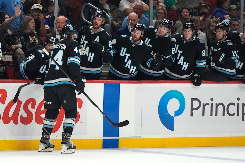 (Charlie Neibergall | AP) Utah Hockey Club's Kevin Connauton celebrates with teammates after scoring during the second period of an NHL preseason hockey game against the St. Louis Blues, Sunday, Sept. 22, 2024, in Des Moines, Iowa.