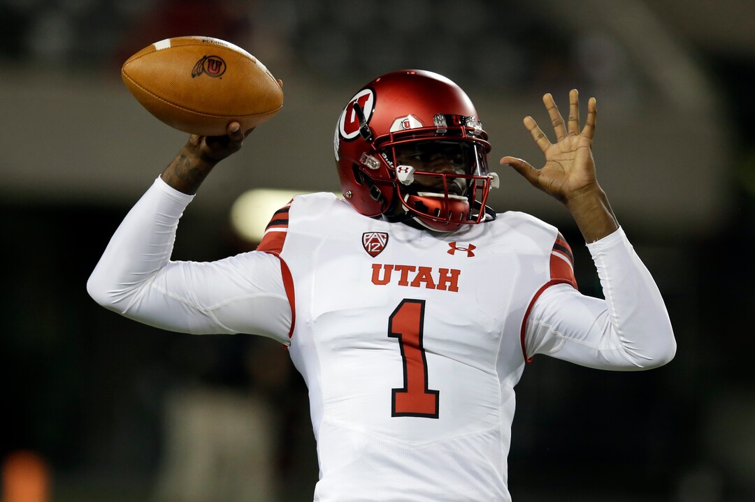 Utah quarterback Tyler Huntley warms up for the team's NCAA college football game against Arizona, Friday, Sept. 22, 2017, in Tucson, Ariz. (AP Photo/Rick Scuteri)
