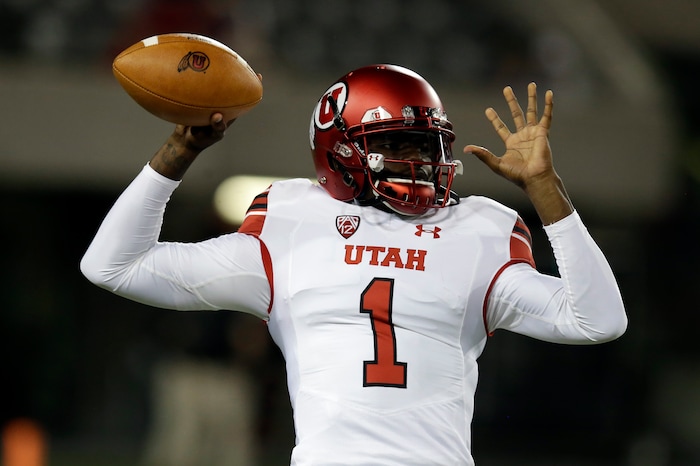 Utah quarterback Tyler Huntley warms up for the team's NCAA college football game against Arizona, Friday, Sept. 22, 2017, in Tucson, Ariz. (AP Photo/Rick Scuteri)