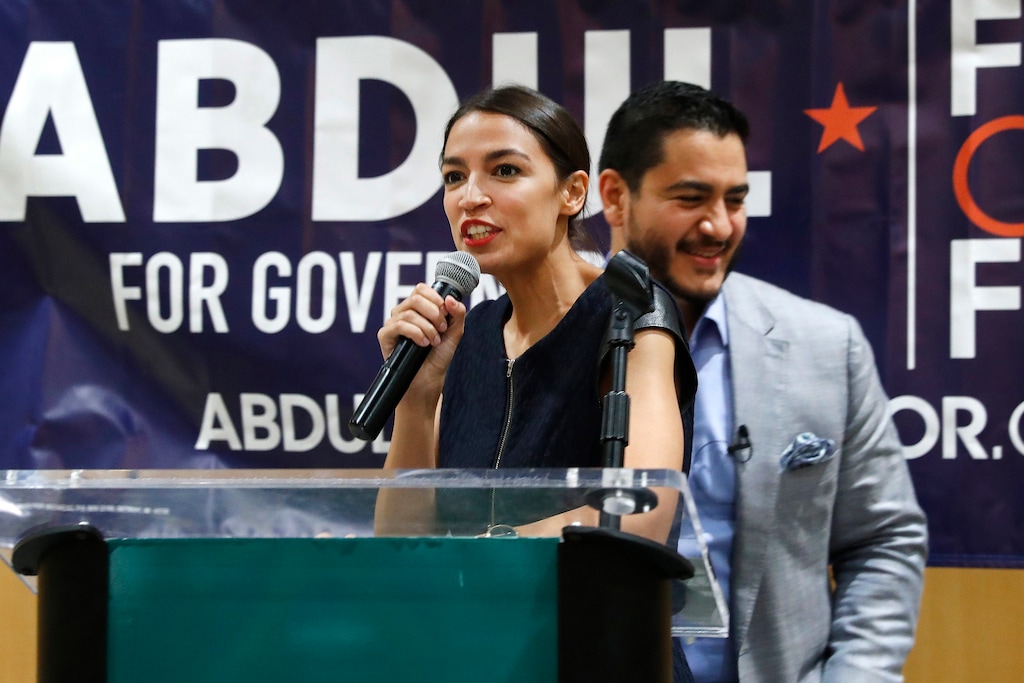(Paul Sancya | The Associated Press) In this Saturday, July 28, 2018, file photo, Alexandria Ocasio-Cortez, a Democratic congressional candidate from New York, speaks during a campaign stop for Michigan for Democratic gubernatorial candidate Abdul El-Sayed, right, in Detroit. Ocasio-Cortez is trying to leverage the 17,000 votes that gave her a primary win in New York into a national movement.