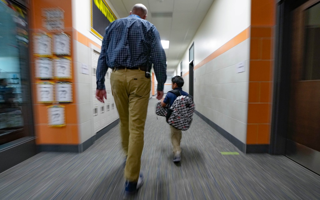 (Francisco Kjolseth  | The Salt Lake Tribune) Edison Elementary principal Richard Squire walks a student to his classroom for the first day of school in Salt Lake City on Tuesday, Aug. 20, 2024.