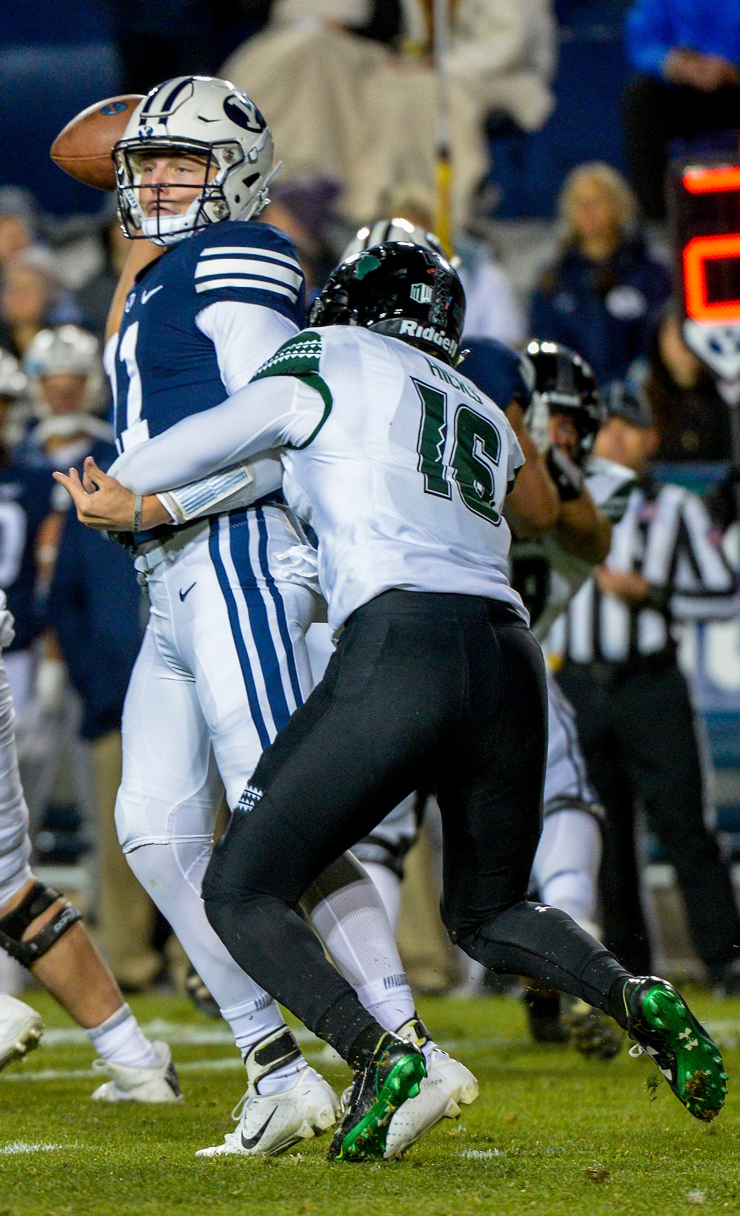 Leah Hogsten  |  The Salt Lake Tribune  Brigham Young Cougars quarterback Zach Wilson gets rid of the ball before getting sacked by Hawaii defensive back Kalen Hicks (16) as Brigham Young University hosts Hawaii at Lavell Edwards Stadium in Provo, Saturday Oct. 13, 2018. 