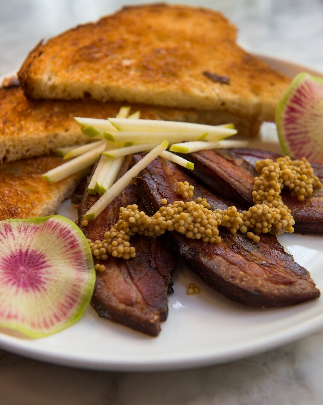 (Leah Hogsten  |  The Salt Lake Tribune) White Horse Spirits and Kitchen's PB&J with Berkshire pork belly, bourbon maple onion jam, brioche, radish and apple, $10.