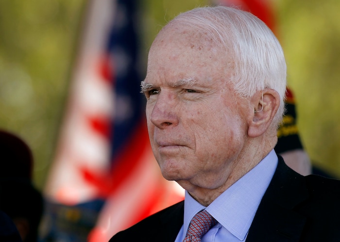 FILE - In this Monday, May 30, 2016, file photo, Sen. John McCain, R-Ariz, looks on during a Phoenix Memorial Day Ceremony at the National Memorial Cemetery of Arizona in Phoenix. A challenge to longtime U.S. Sen. McCain leads the lists of contests drawing attention in Tuesday's Arizona primary election. (AP Photo/Ralph Freso, File)