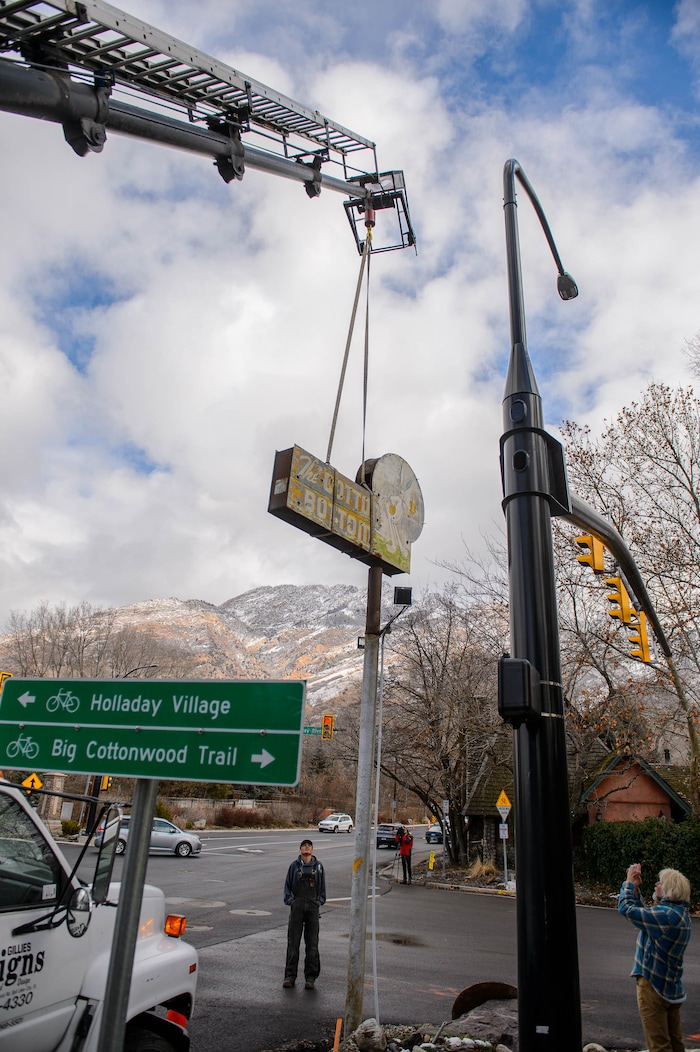 (Trent Nelson  |  The Salt Lake Tribune) The iconic sign at the Cotton Bottom Inn in Holladay is removed on Thursday, Jan. 9, 2020. The sign is being restored by Brimley Neon, which specializes in vintage sign repair.