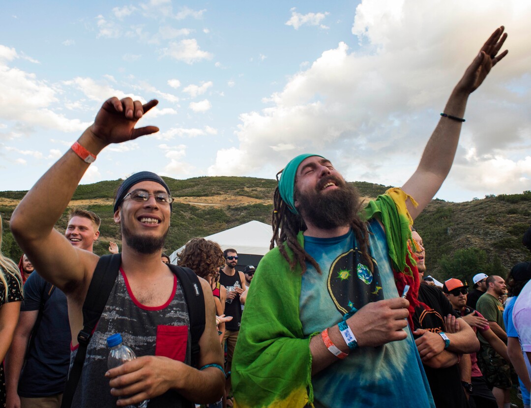 (Rick Egan  |  The Salt Lake Tribune)    Mori Ortiz, from Murray and Garrett Goodwill, from Logan, dance to the music of Stephen Marley as he plays the opening day of the 3-day Reggae Rise Up Festival at the Rivers Edge in Heber City, Friday, Aug. 24, 2018.